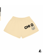 Chi Omega Free Spirit Light Yellow Shorts by Alpha Apparel Co. – front view